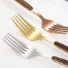 Three forks with wooden handles and different colored heads are arranged diagonally on a white surface. Produktbild-Vorschau