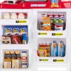 A toy supermarket checkout counter with various miniature grocery items displayed on shelves. Náhled obrázku produktu
