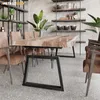 A dining room scene with a live-edge wood table and chairs. Produktbild-Vorschau