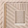 A close-up view of the underside of a rug, showing its natural jute bottom and a woven pattern. Podgląd zdjęcia produktu