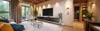 A modern living room with a TV and entertainment unit. Produktbild-Vorschau