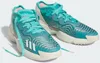 A pair of teal and white Adidas basketball shoes. Voir les images du produit