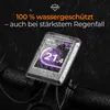 A close-up of an e-bike display screen covered in water droplets, with text overlay indicating water resistance. Produktbild-Vorschau