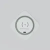 A white wireless charging pad with a green ring and charging symbol is shown against a light gray background. Produktbild-Vorschau