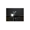 A close-up shot of a bicycle's handlebars with a white LED light attached. Produktbild-Vorschau