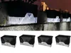 Solar-powered garden lights mounted on a stone wall at night. Podgląd zdjęcia produktu