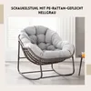 A light gray papasan-style rocking chair with a thick cushion, placed indoors near a window. Produktbild-Vorschau