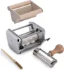 A collection of pasta-making accessories, including a ravioli maker, a cutting attachment, and a brush, arranged on a white background. Voir les images du produit