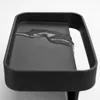 A close-up of a black sponge holder with water on it. Náhled obrázku produktu