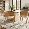A dining room setting with a table and chairs. Produktbild-Vorschau