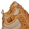 A close-up view of the top part of two brown Adidas Hoops 3.0 Mid Wtr shoes, showing the fuzzy lining and laces. Anteprima dell’immagine prodotto