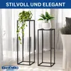 Two black metal plant stands with plants in pots, placed in front of sheer curtains. Anteprima dell’immagine prodotto