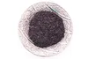 A pile of loose black tea leaves sits in a decorative silver bowl. Náhľad obrázku produktu