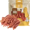 A bag of dog treats with some treats spilled out in front of it. Produktbild-Vorschau