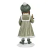 A figurine of a girl in a green coat and hat holding a candle, standing on a snowy base. Voir les images du produit