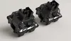 Two black and clear mechanical keyboard switches are shown on a light gray background. Anteprima dell’immagine prodotto