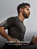 A man is running outdoors with wireless earbuds and an armband. Voir les images du produit