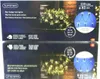 The image shows the packaging for Lumineo LED hedge net lights, with a picture of the product in use on the box. Produktbild-Vorschau