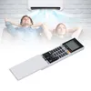 A couple relaxing on a couch while an air conditioner cools the room, with a remote control in the foreground. Produktbild-Vorschau