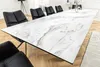 A long dining table with a marble-like surface and black chairs around it. Produktbild-Vorschau