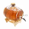 A glass barrel dispenser filled with amber liquid, resting on a wooden stand. Produktbild-Vorschau