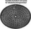 The underside of a black oval pot lid with a speckled pattern and numerous small holes, with an arrow pointing to the text describing its features. Voir les images du produit