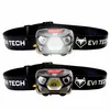 Two identical black and gray headlamps with illuminated bulbs and black straps are shown against a white background. Náhled obrázku produktu