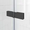 A close-up view of a black shower hinge on a tiled wall. Anteprima dell’immagine prodotto