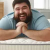 A man is lying on a mattress. Produktbild-Vorschau