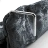 A close-up shot of a metallic handle attached to a fuzzy, dark gray fabric. Produktbild-Vorschau