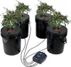 A hydroponics grow system with four buckets, each containing a plant, connected to an air pump. Produktbild-Vorschau