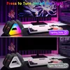 A gaming setup with a monitor, keyboard, and a charging station for controllers, showcasing different lighting modes. Produktbild-Vorschau