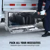 A person is placing a toolbox into an underbody truck box. The truck box is open and shows other toolboxes inside. Text at the bottom reads 'PACK ALL YOUR NECESSITIES'. Produktbild-Vorschau