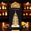 A perfume bottle with decorative elements and surrounding natural items. Voir les images du produit