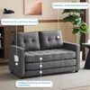 A gray sofa is shown in a living room setting with decorative elements and feature callouts. Produktbild-Vorschau
