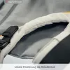 A close-up view of the padded leg area of a baby carrier. Produktbild-Vorschau