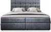 A studio shot of a gray upholstered box spring bed with a tufted headboard, set against a white background. Produktbild-Vorschau
