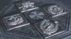 A collection of six metallic emblems arranged in a hexagonal pattern on a stone surface. Produktbild-Vorschau