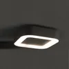 A modern, square-shaped LED ceiling light with rounded corners, emitting a soft, diffused light against a dark gray ceiling. Náhled obrázku produktu