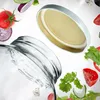 A close-up shot of a glass jar with a lid, surrounded by various salad ingredients like tomatoes, cucumbers, and lettuce, suggesting a food preservation or salad preparation context. Produktbild-Vorschau
