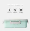 A light green lunchbox with a gray lid and latch, set against a white background. Above the lunchbox are three icons with text labels: 'wheat straw', 'Degradable', and 'Food grade', along with the text 'Made of natural wheat straw, BPA free'. Náhled obrázku produktu