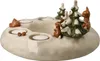 A ceramic advent wreath with four tea light holders, decorated with snow-covered pine trees, a rabbit, and a deer. Anteprima dell’immagine prodotto