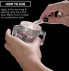 A person's hands are shown holding a jar of Filorga Ncef-Reverse cream and a spatula. Voir les images du produit