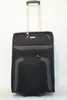 A black and gray Travelite trolley suitcase with a silver retractable handle is shown against a white background. Náhľad obrázku produktu
