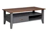 A coffee table with a drawer and shelf.