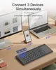 A desk setup with a monitor, laptop, smartphone, and keyboard, showcasing connectivity. Produktbild-Vorschau