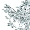 A close-up view of a decorative lamp with many clear, flower-shaped acrylic glass elements attached to thin metal wires. Náhled obrázku produktu