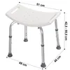 A white adjustable shower stool with silver metal legs and gray rubber feet, shown from a diagonal angle on a white background. Dimensions are indicated with lines and text. Voir les images du produit