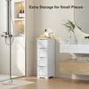 A white wooden cabinet with four drawers is placed in a bathroom next to a shower and a sink. Produktbild-Vorschau