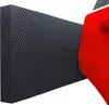 A black textured mat is placed next to a red car door. Podgląd zdjęcia produktu